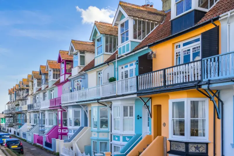 Colorful beach houses with balconies in Whitstable Kent, one of the cheap places to go on holiday in UK