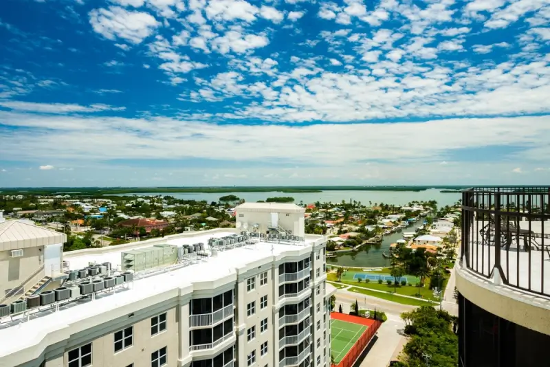 Beachfront hotel balcony view overlooking Fort Myers Beach waterways and coastal neighborhoods in Florida