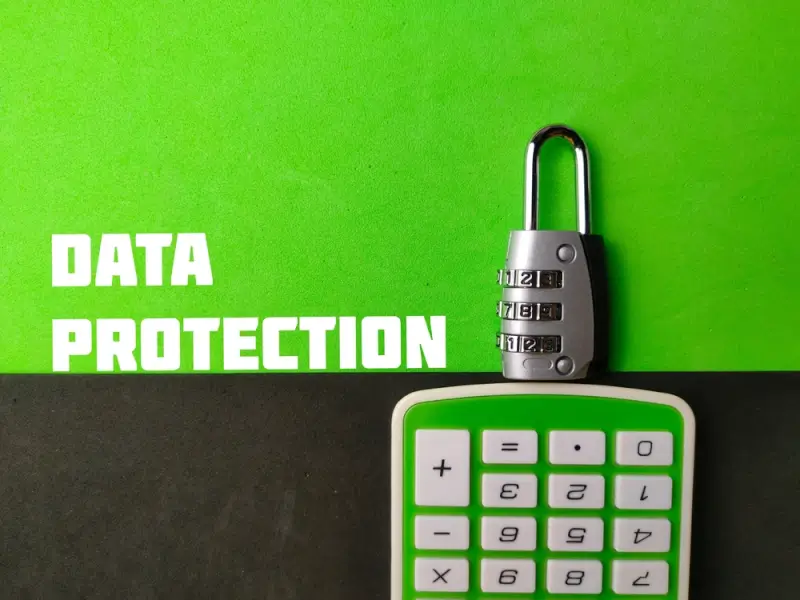 Combination padlock and calculator on green background illustrating strong password security for remote workers