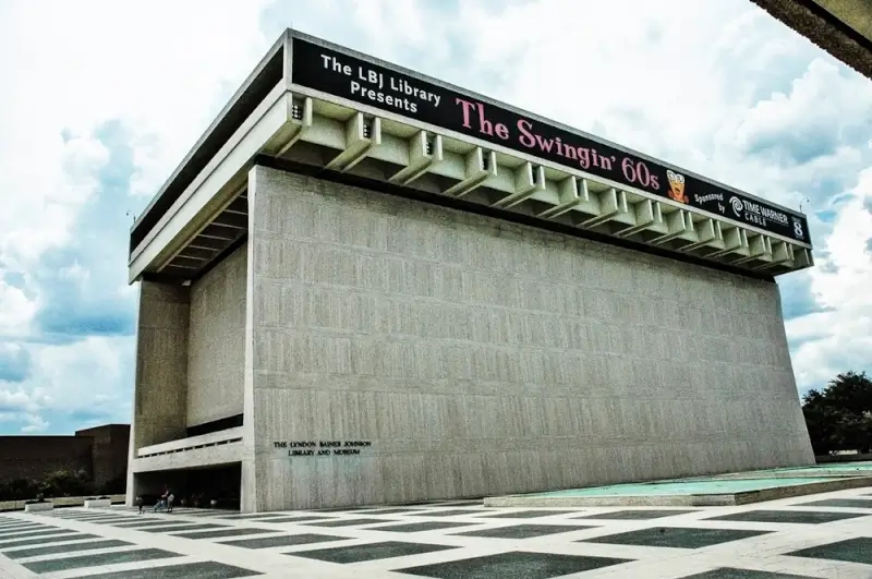 LBJ Presidential Library exterior with Swingin' 60s exhibit banner in Austin, Texas
