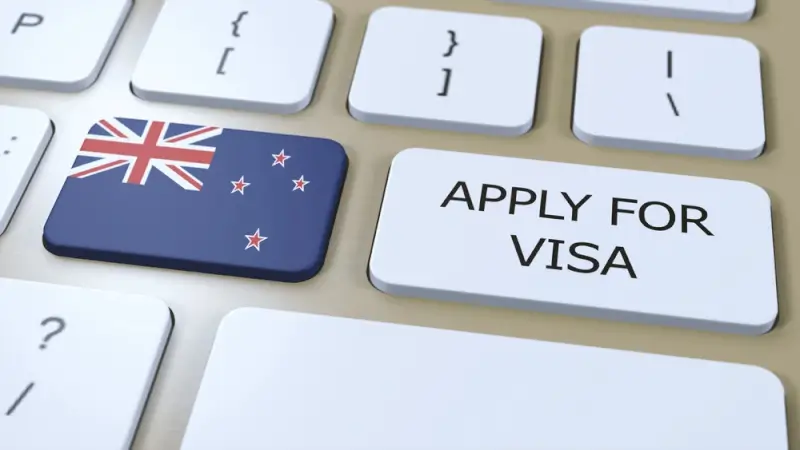 Applying for immigration visa to New Zealand shown on keyboard with flag button and apply for visa key