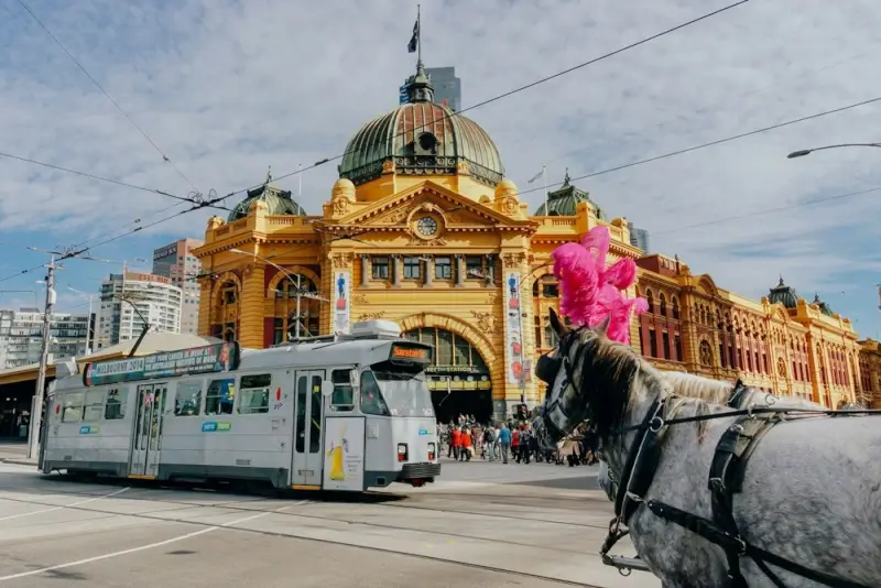 Flinders Street Station with tram and horse carriage in Melbourne CBD