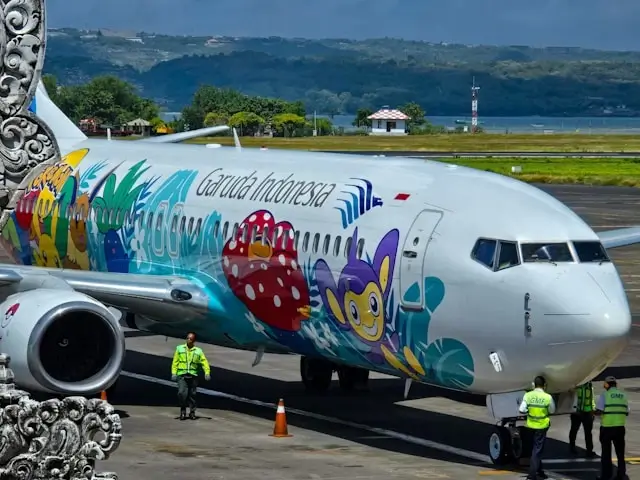 Garuda Indonesia airplane with colorful livery at Ngurah Rai International Airport in Bali