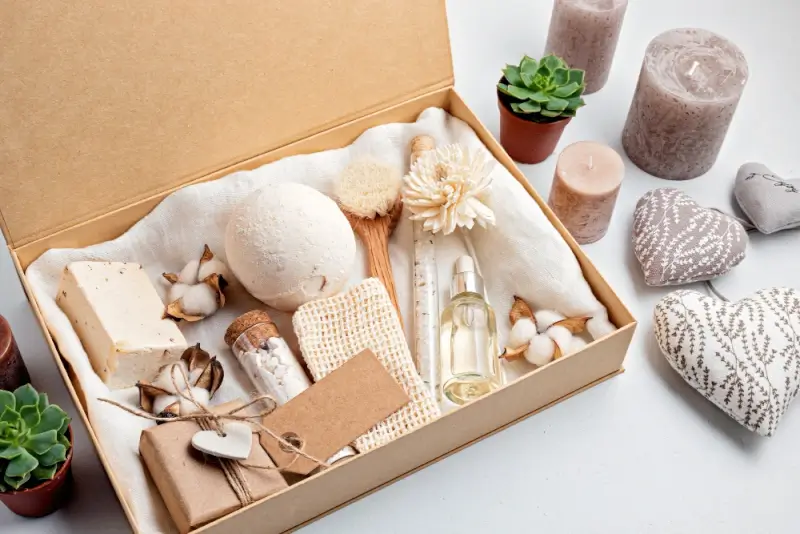 Spa gift box with bath products, candles, and natural wellness items for relaxing self-care christmas present