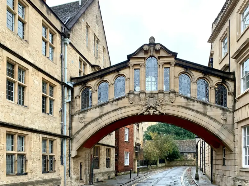 Bridge of Sighs connecting Hertford College buildings in Oxford on an overcast day with historic stone architecture