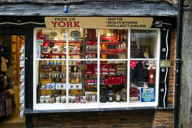Traditional souvenir shop window displaying British collectables and gifts in York's historic city center