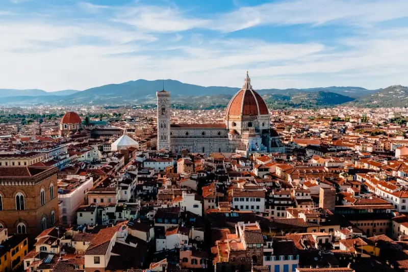 Panoramic view of Florence Duomo and terracotta rooftops showcasing popular immigration services in Europe destination for expats