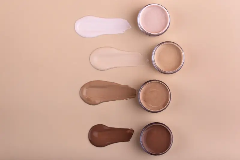 Tinted foundation swatches in four inclusive shade ranges from light to deep showing hybrid skincare makeup