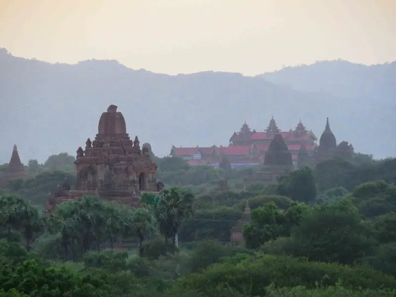 Ancient temples and pagodas rising above the trees in Bagan, one of the most iconic myanmar historical sites