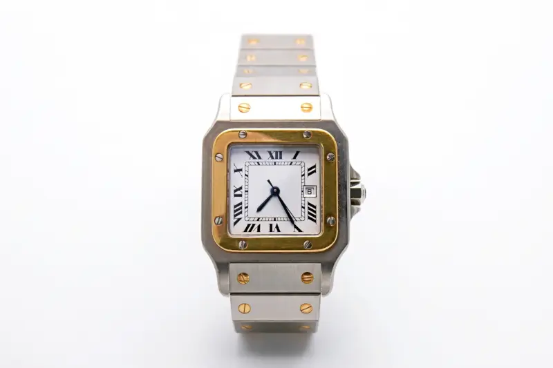 A Cartier Panthere watch with a square dial, Roman numerals, and a two-tone gold and stainless steel bracelet on a white background