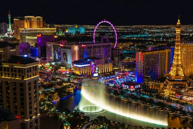 Las Vegas Strip at night with Bellagio fountains and illuminated casino hotels