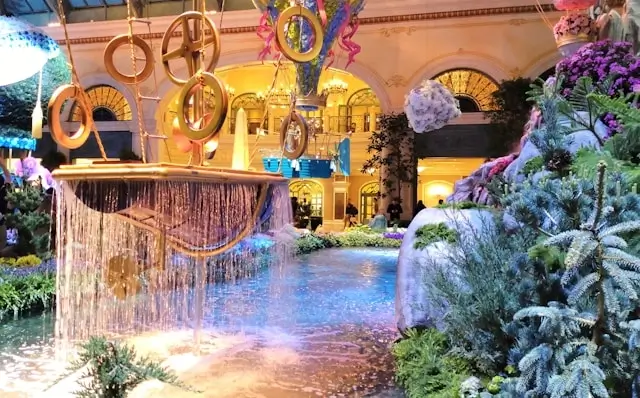 Luxury hotel conservatory with waterfall fountain and seasonal decorations in Vegas