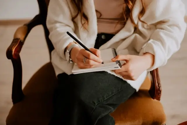 psychiatrists in los angeles taking notes during a therapy session with a patient