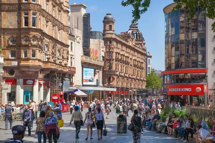 Leicester Square London bustling street scene close to a girls' trip hotel
