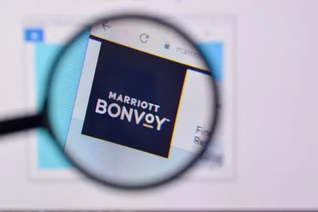 Marriott Bonvoy website viewed through a magnifying glass for trip hotel booking