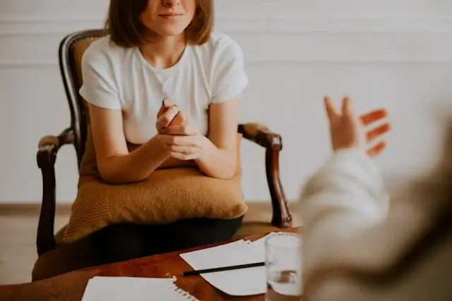 woman with co-occurring mental health conditions listening attentively during a psychiatric consultation