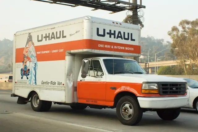 U-Haul moving truck on a highway heading to a long distance move destination