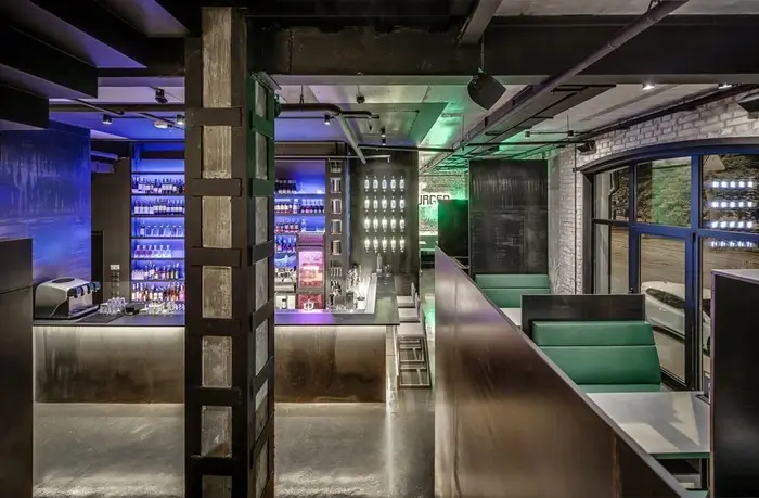 Rooftop lounge bar with neon lights at Moxy NYC Chelsea hotel