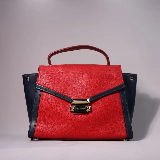 Timeless handbags for women in red and navy leather with gold hardware