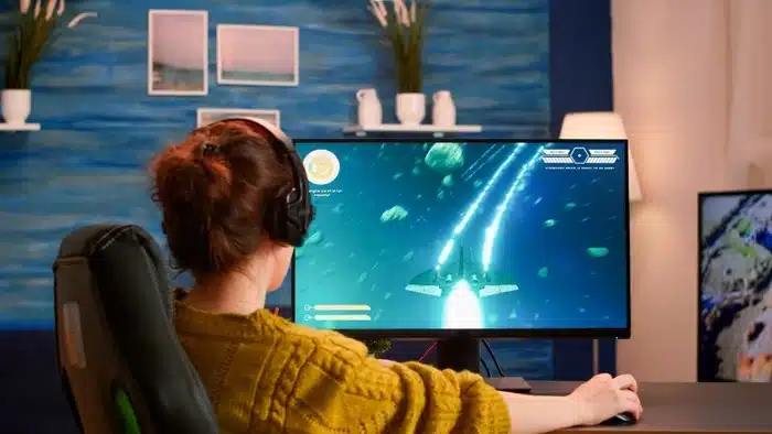 woman playing computer game at home on weekend