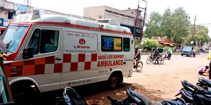 basic life support ambulance on a busy street in India