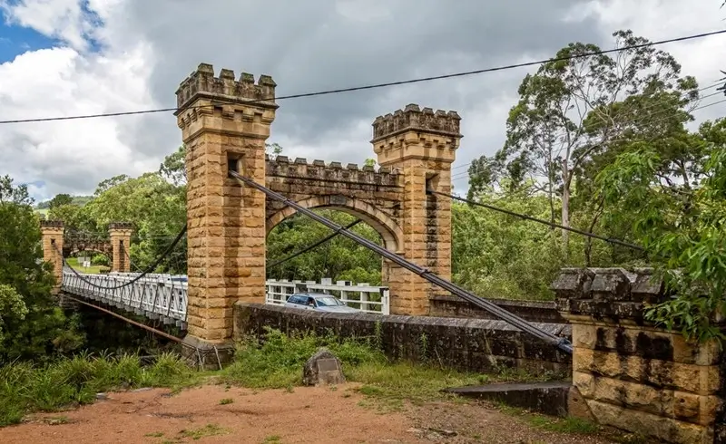 historic Hampden suspension bridge surrounded by lush greenery in Kangaroo Valley NSW