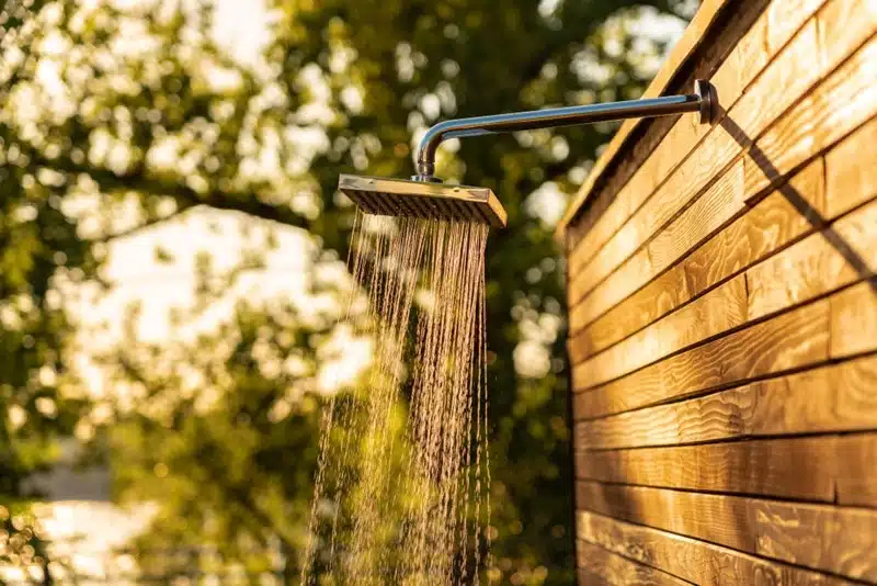 outdoor shower facility at a campsite for campervan travelers