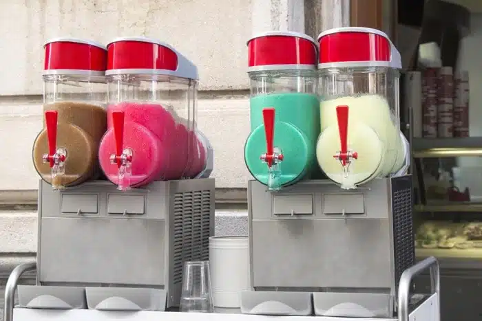 Two multi-bowl commercial slush machine features displayed outdoors with multiple flavors ready for service.