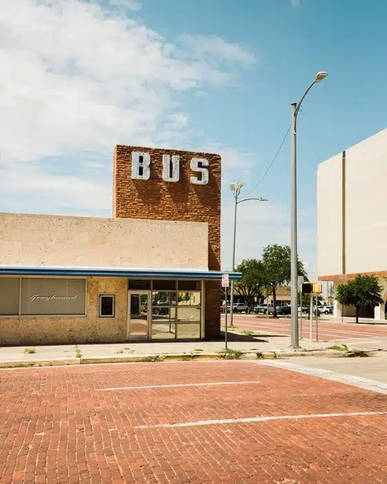 Texas bus ticket station in Amarillo showing an abandoned Greyhound terminal with a large BUS sign on the brick wall