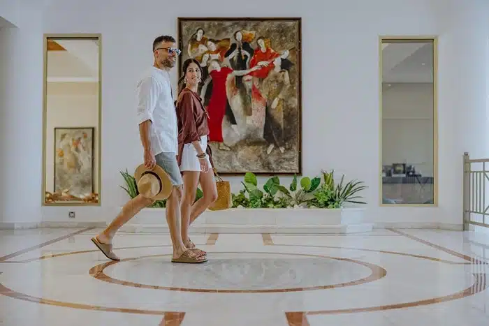 Couple walking through the lobby of a beachfront hotel in Protaras