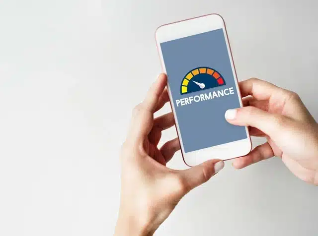 smartphone screen with a speed gauge graphic representing internet performance