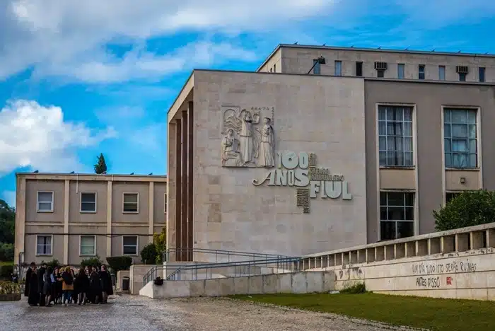 Students in graduation gowns gathered outside the Faculty of Letters at the University of Lisbon campus