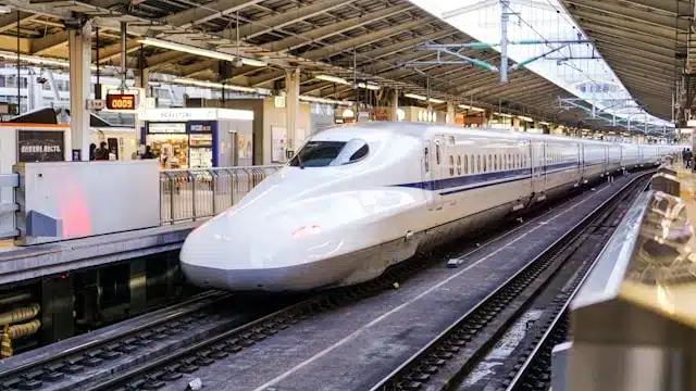 Japan Shinkansen bullet train at a station platform ready for departure