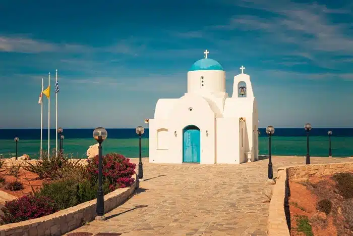 White orthodox church with blue dome by the sea in Protaras, Cyprus