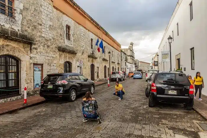 SUV cars parked on a cobblestone street in the colonial zone of Santo Domingo, Dominican Republic