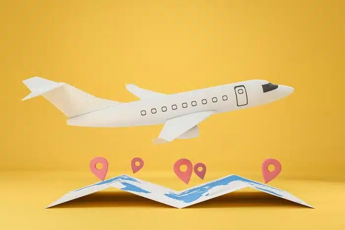 miniature plane above an open map with location markers representing spontaneous destinations