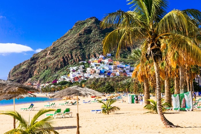 Best time to visit Spain — colorful hillside village overlooking Las Teresitas beach in Tenerife, Canary Islands