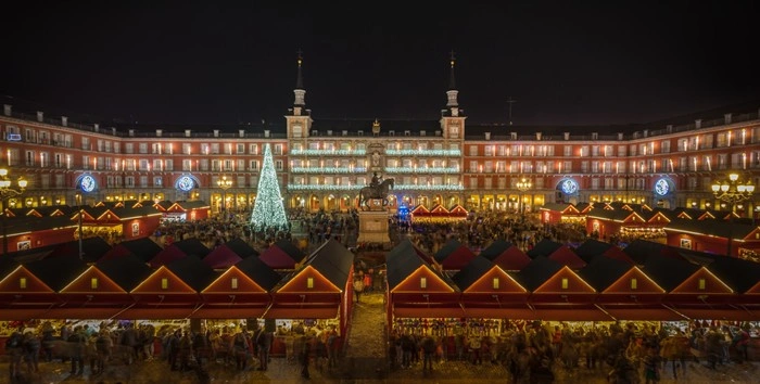 Christmas market lights up Plaza Mayor in Madrid during the winter holiday season