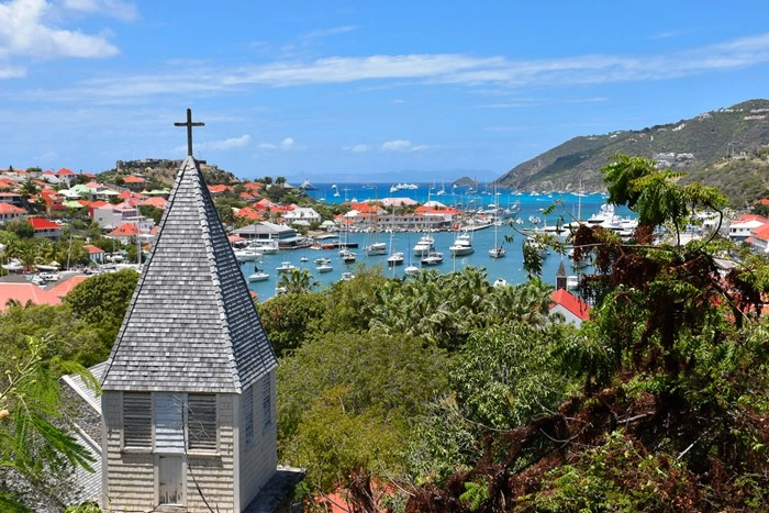 Historic church steeple overlooking Gustavia's harbor, a scenic view for those exploring St Barts