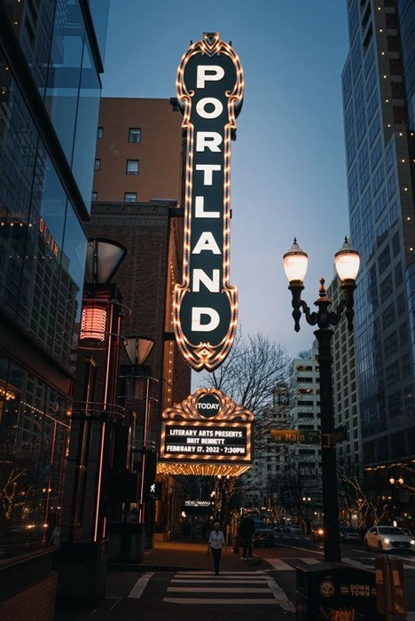 Historic Portland theater marquee lit up at dusk in downtown Portland, Oregon