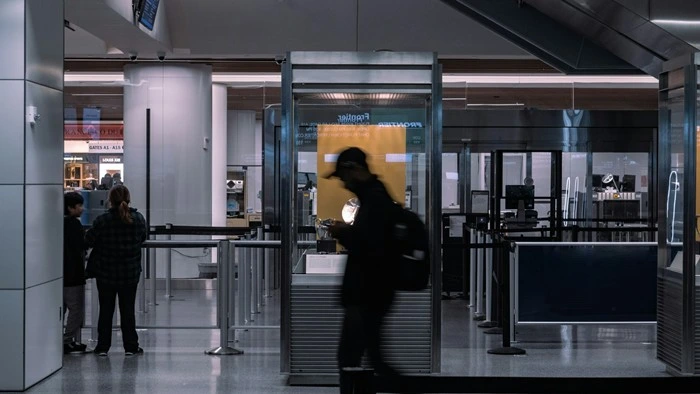 Travelers passing through a TSA airport security checkpoint, relevant for firearm declaration rules when flying