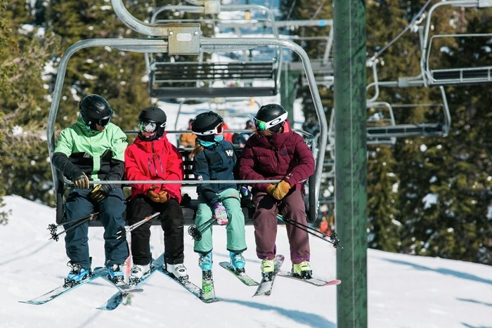 Things to do in Kirkwood, California — family riding the chairlift together