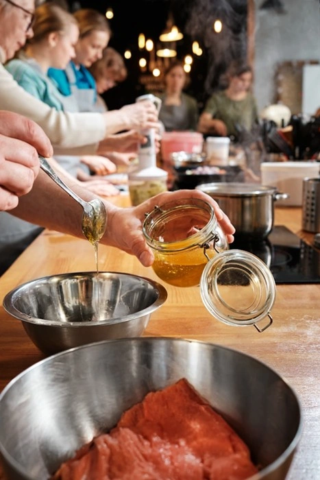 Group cooking class with hands-on food prep, a hallmark of immersive travel dining