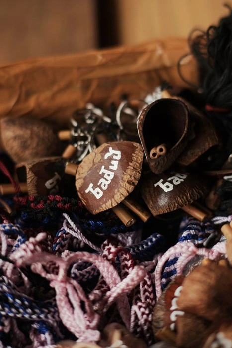 Handmade wooden keychain souvenirs from a local artisan in Banten, Indonesia