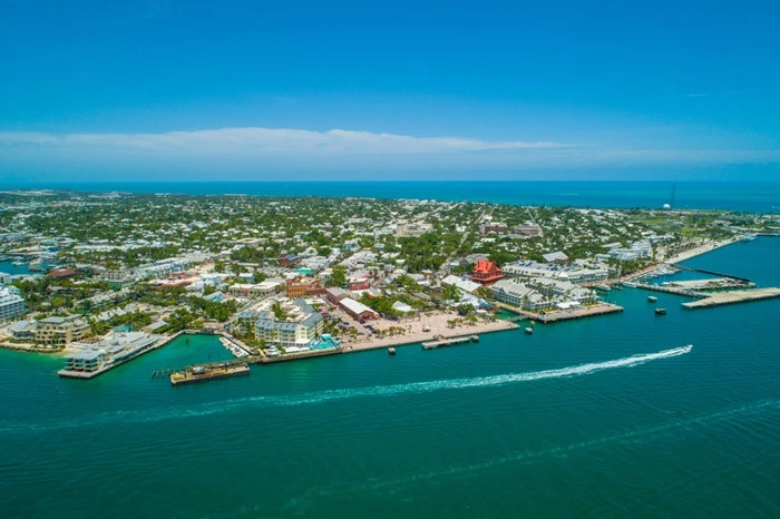 Aerial view of Key West, Florida coastline with marina, boats, and turquoise water