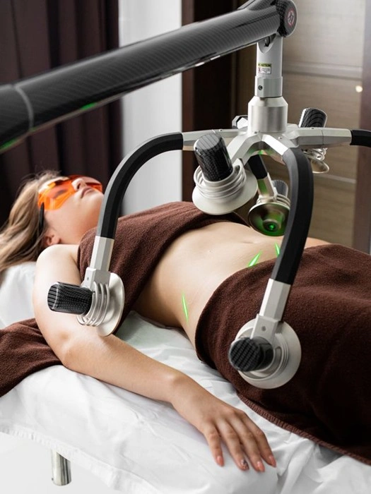 Laser body contouring session using multi-arm cold laser equipment