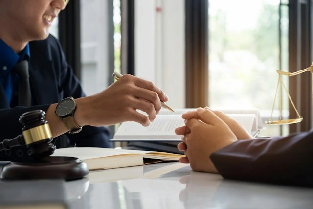 Lawyer consulting with a client about a nursing home abuse case