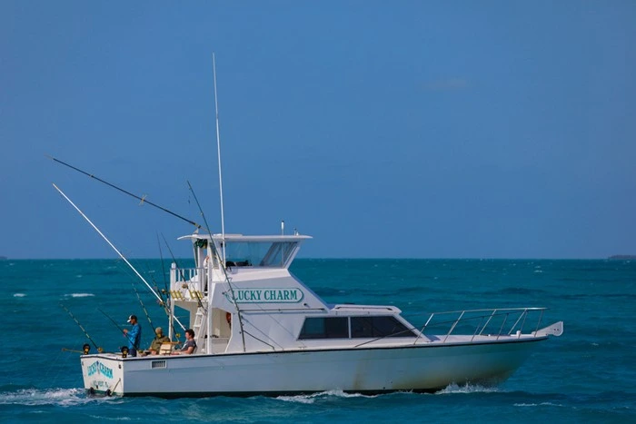Fishing trip in Key West Florida aboard the Lucky Charm charter boat with anglers casting lines