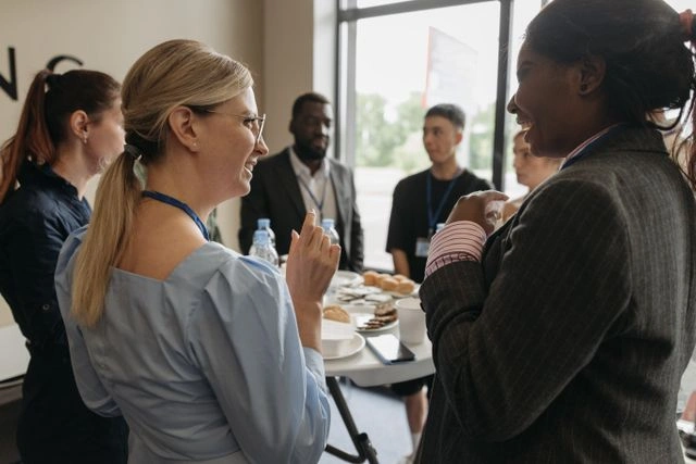 Professionals networking and building industry connections at a conference event
