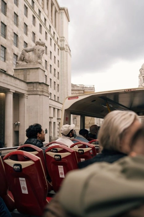 Tourists Riding an Open-Top Sightseeing Bus on a Guided City Tour